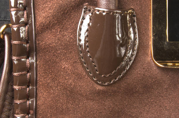 istock seams on leather hand bag 852188818