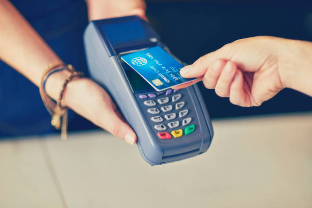 istock Customer making contactless payment through credit card in coffee shop 852196052