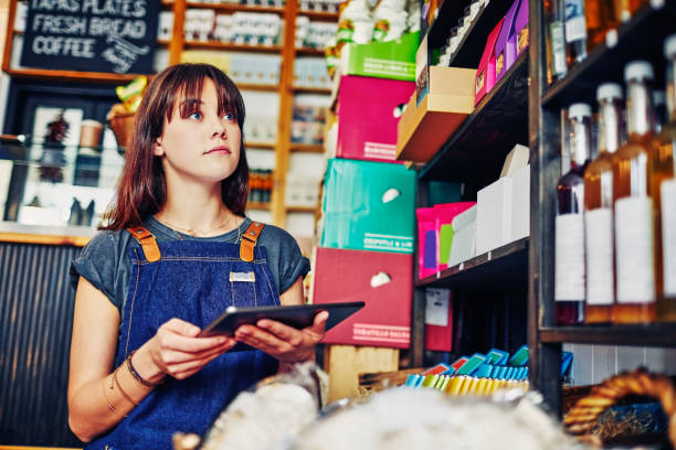 istock Female owner doing the inventory with digital tablet in deli 852196152