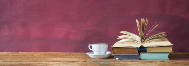 istock open book and cup of coffee cup 852199340