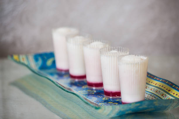 Sweet dessert with coconut. Malabi is the original Arabic delicacy. Background - porcelain rectangular patterned dish.  Professional bakery