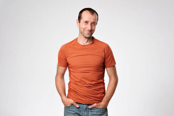 istock Smiling mature caucasian man standing with arms in pockets 852204902