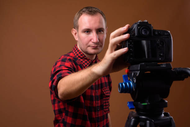 istock Studio shot of man getting ready for vlogging against colored background 852222476