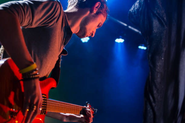 istock Guitarist playing guitar on stage 852225382