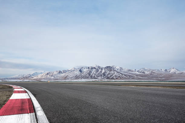 istock empty asphalt road with beautiful snow mountains 852228550