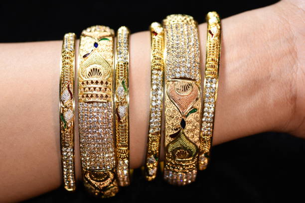 istock Fancy gold looking imitation bangles / bracelets on the woman's wrist 852228694