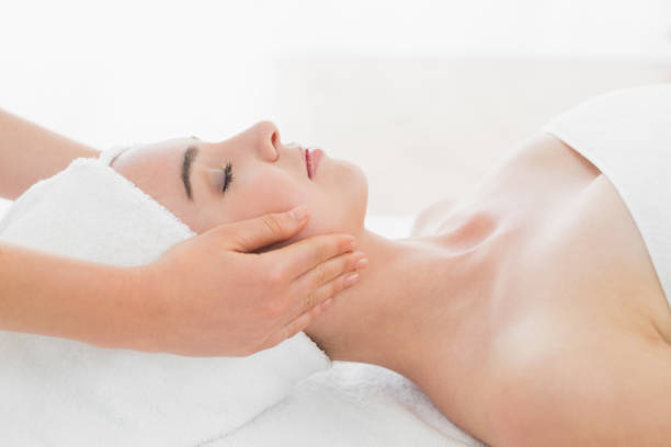 istock Hands massaging womans face at beauty spa 852236936