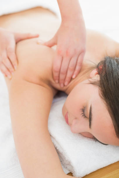 istock Woman enjoying shoulder massage at beauty spa 852237102