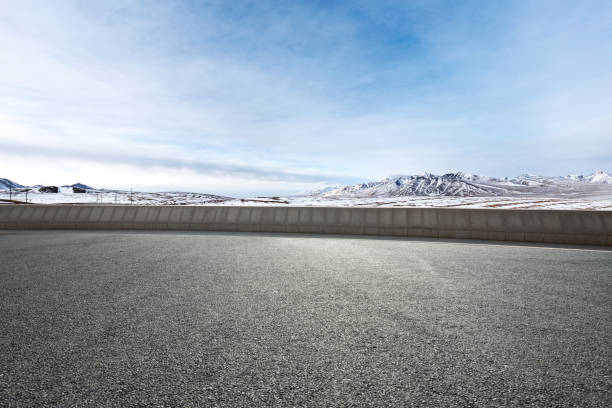 istock empty asphalt road with beautiful snow mountains 852244200
