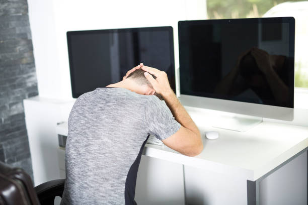 istock Young business man with problems and stress in the office 852247938