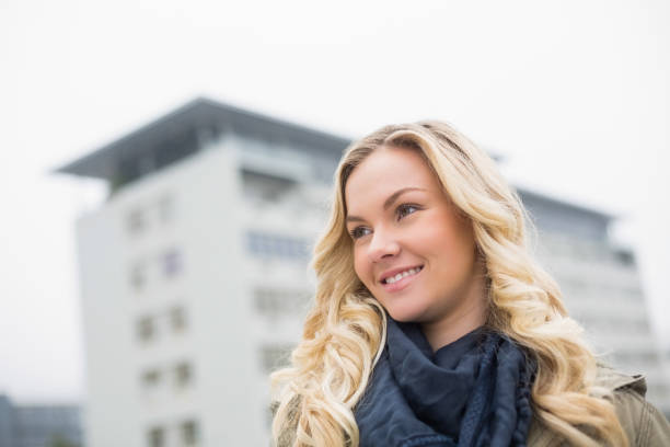 istock Cheerful trendy blonde posing outdoors 852252150