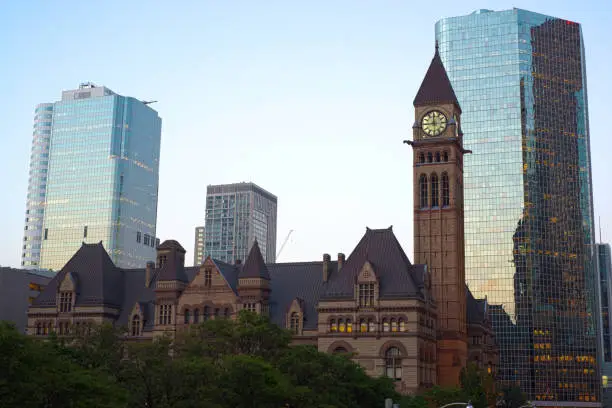 A view of downtown toronto with Old City Hall building in the background.