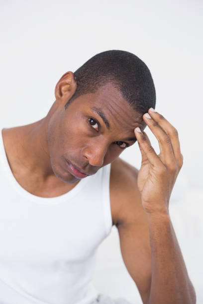 istock Portrait of an Afro man suffering from headache 852286324