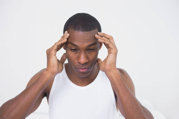 istock Close up of a young Afro man suffering from headache 852286398