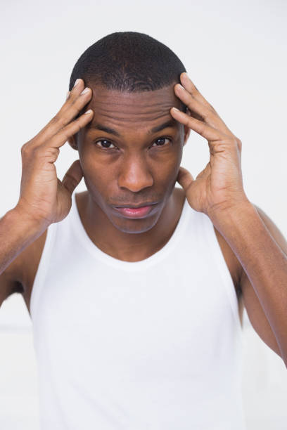 istock Close up of a young Afro man suffering from headache 852286440