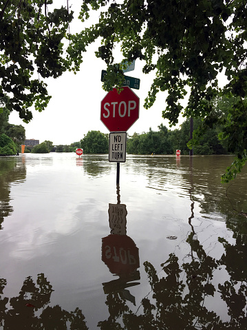 A partially submerged stop sign during Hurricane Harvey