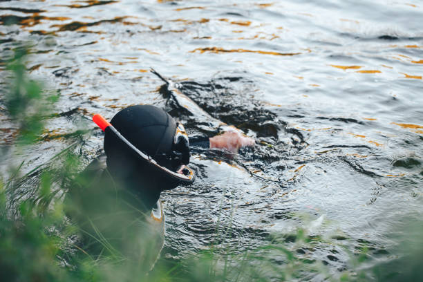 istock Hunter Fisherman is Hunting a Fish on the River 852292978