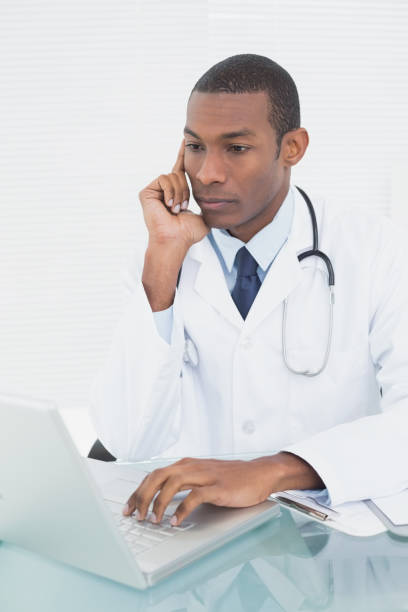 istock Doctor using laptop at medical office 852295540