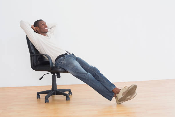 istock Thoughtful casual man sitting on office chair in empty room 852310844