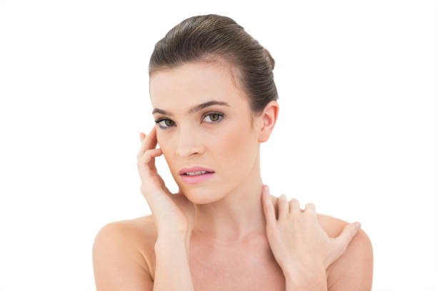 istock Attractive woman holding hand on face and shoulder 852313024