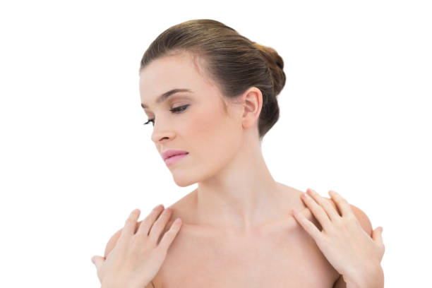 istock Calm natural brown haired model touching her shoulders 852319882