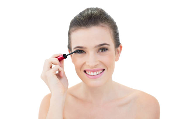 istock Joyful natural brown haired model applying mascara 852324542