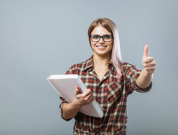 istock Handsome young girl with white book 852331802