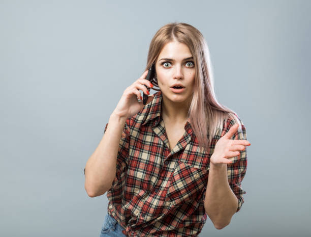 istock Beautiful young woman while conversation on smartphone 852331916