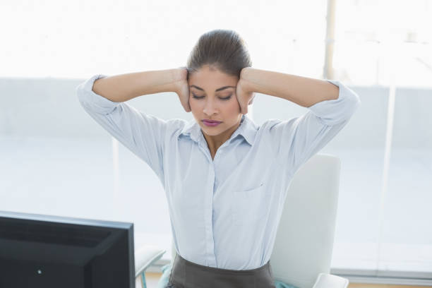 istock Businesswoman suffering from headache at office 852355886