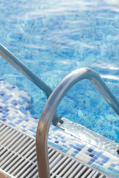 istock Blue swimming pool on hot sunny day on summer vacation. 852363288