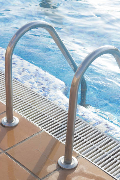 istock Blue swimming pool on hot sunny day on summer vacation. 852363314