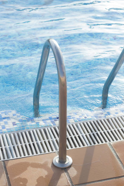 istock Blue swimming pool on hot sunny day on summer vacation. 852363340