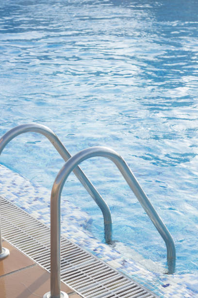 istock Blue swimming pool on hot sunny day on summer vacation. 852363400