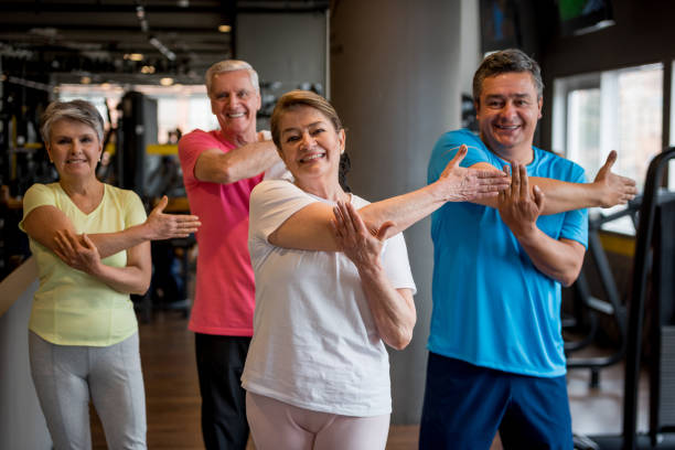 istock Group of senior adults stretching at the gym 852401254