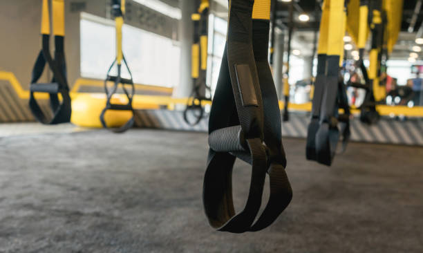 Suspension equipment at the gym Suspension equipment at an empty gym - fitness concepts suspension training stock pictures, royalty-free photos & images