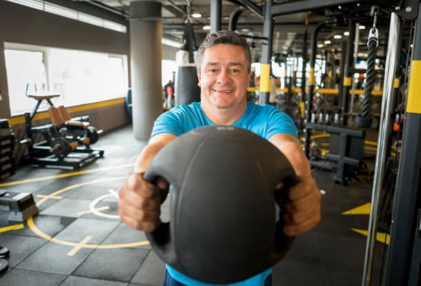 istock Adult man exercising at the gym 852401516