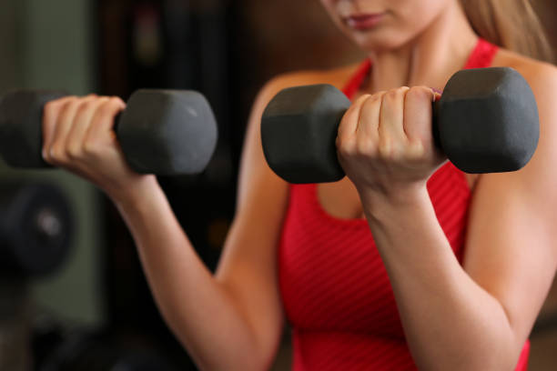 istock Sporty young woman work out biceps. 852403834