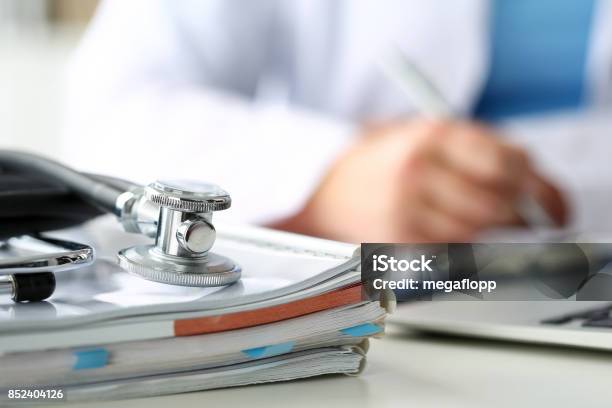 Stethoscope Head Lying On Medical Forms Closeup Stock Photo - Download Image Now - Healthcare And Medicine, Medical Exam, Doctor