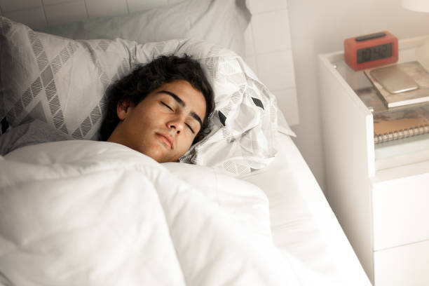 Boy sleeping late A young boy sleeping late. tawny stock pictures, royalty-free photos & images