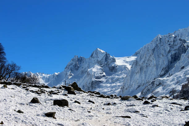 A mountain peak in Pyrenees, France, partially covered with fog