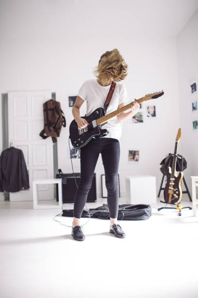 istock Woman playing guitar 852422098