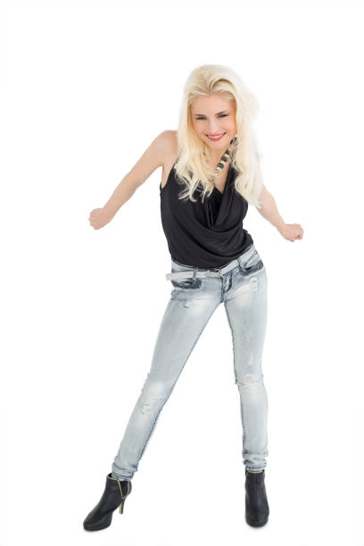 istock Full length of a happy casual blond dancing 852429716