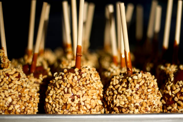 istock Sunlit Candy Apples Up Close; Black Background 852436198