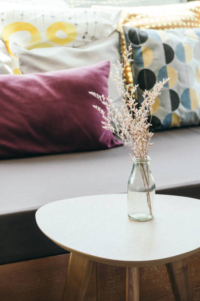 istock flower vase on table decoration with pillow and sofa 852439238