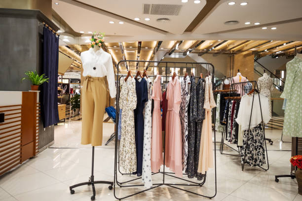 fashionable clothes in modern shopping mall fashing store in modern shopping mall garment store fashion rack stock pictures, royalty-free photos & images