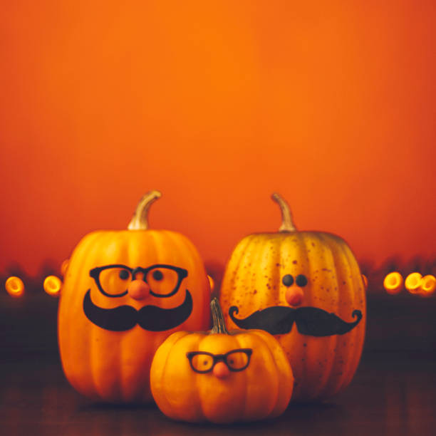istock Cute pumpkin halloween characters on bright orange background 852442312