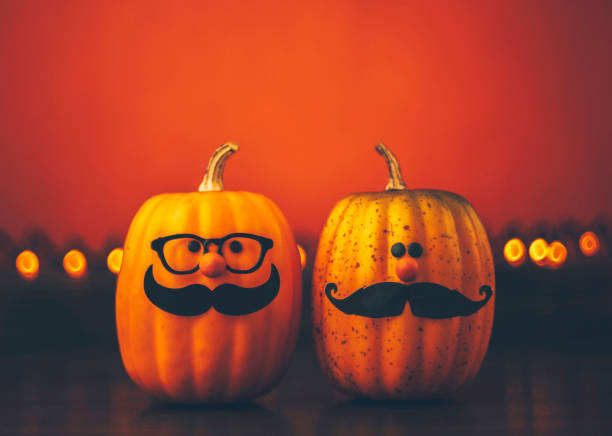 istock Cute pumpkin halloween characters on bright orange background 852442324