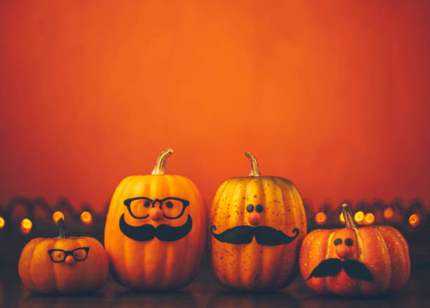 istock Cute pumpkin halloween characters on bright orange background 852442360