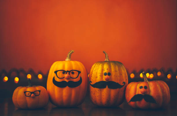 istock Cute pumpkin halloween characters on bright orange background 852442498