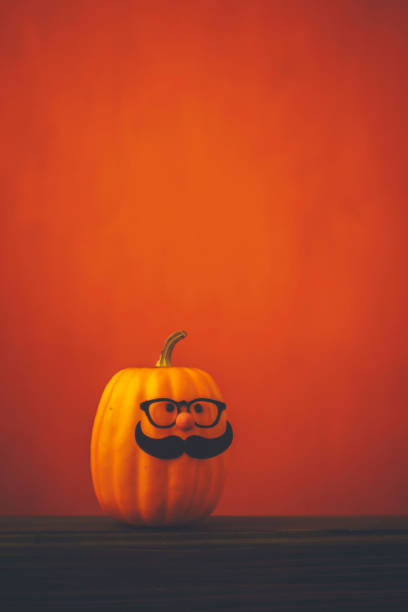istock Cute pumpkin halloween character on bright orange background 852442534